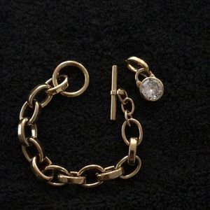 Michael Kors 7.5 in gold bracelet w diamond charm